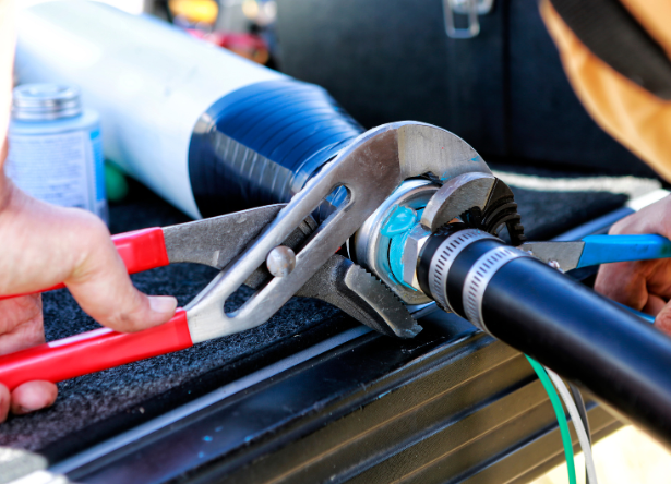 professional-plumber-from-rob-millar-plumbers-repairing-a-leaky-faucet-to-prevent-costly-plumbing-issues