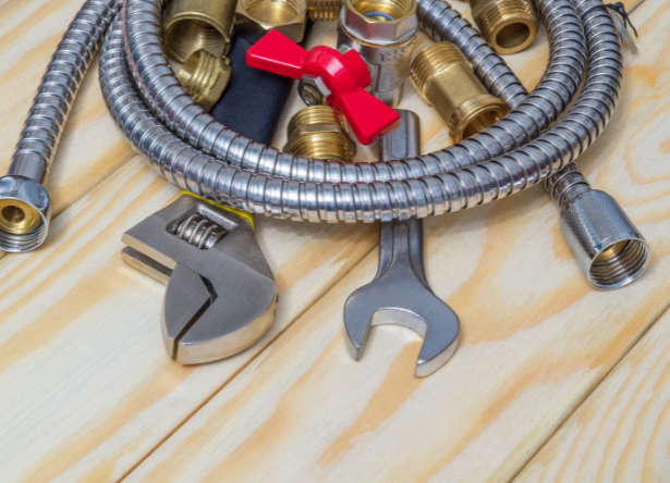 plumber-from-rob-millar-plumbers-checking-water-pressure-to-prevent-costly-plumbing-damage